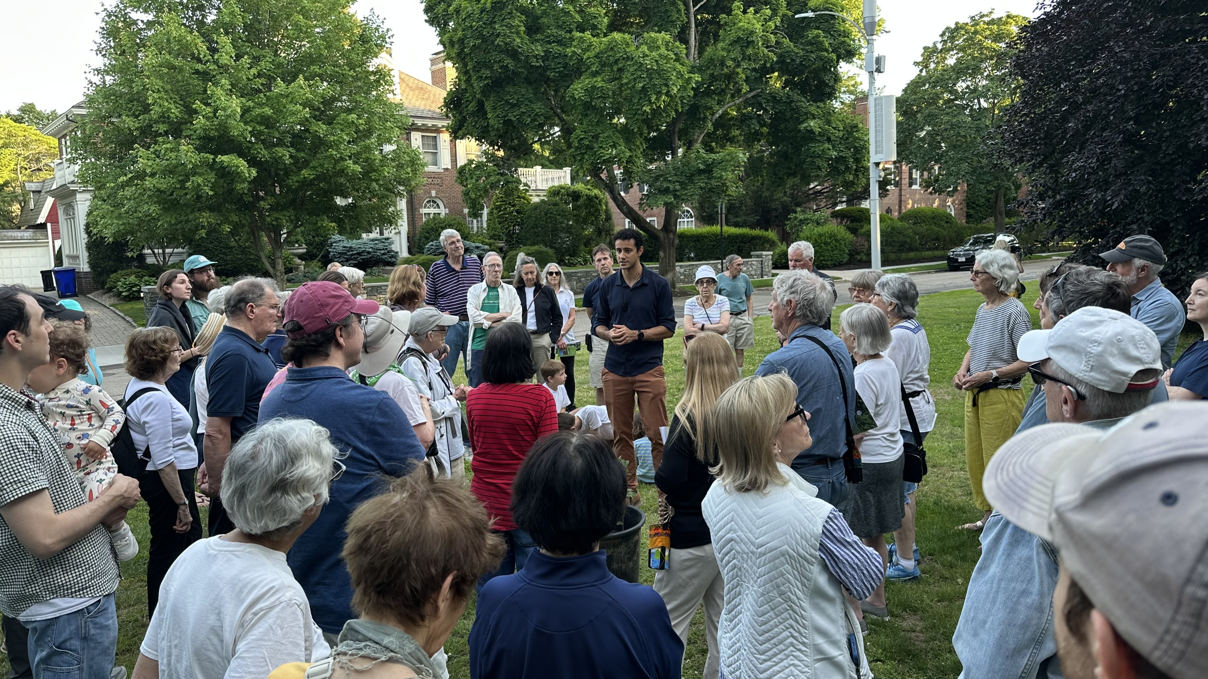 Jack Schleifer speaking with a circle of attendees at Longwood Mall